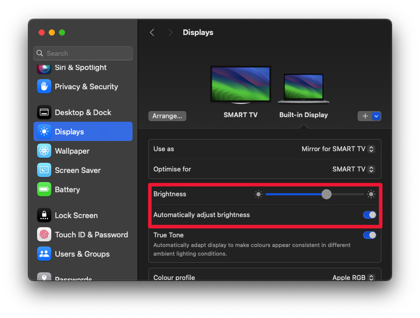 Screenshot showing how to reduce brightness and automatically adjust brightness to fix Battery drain in MacBook Pro.